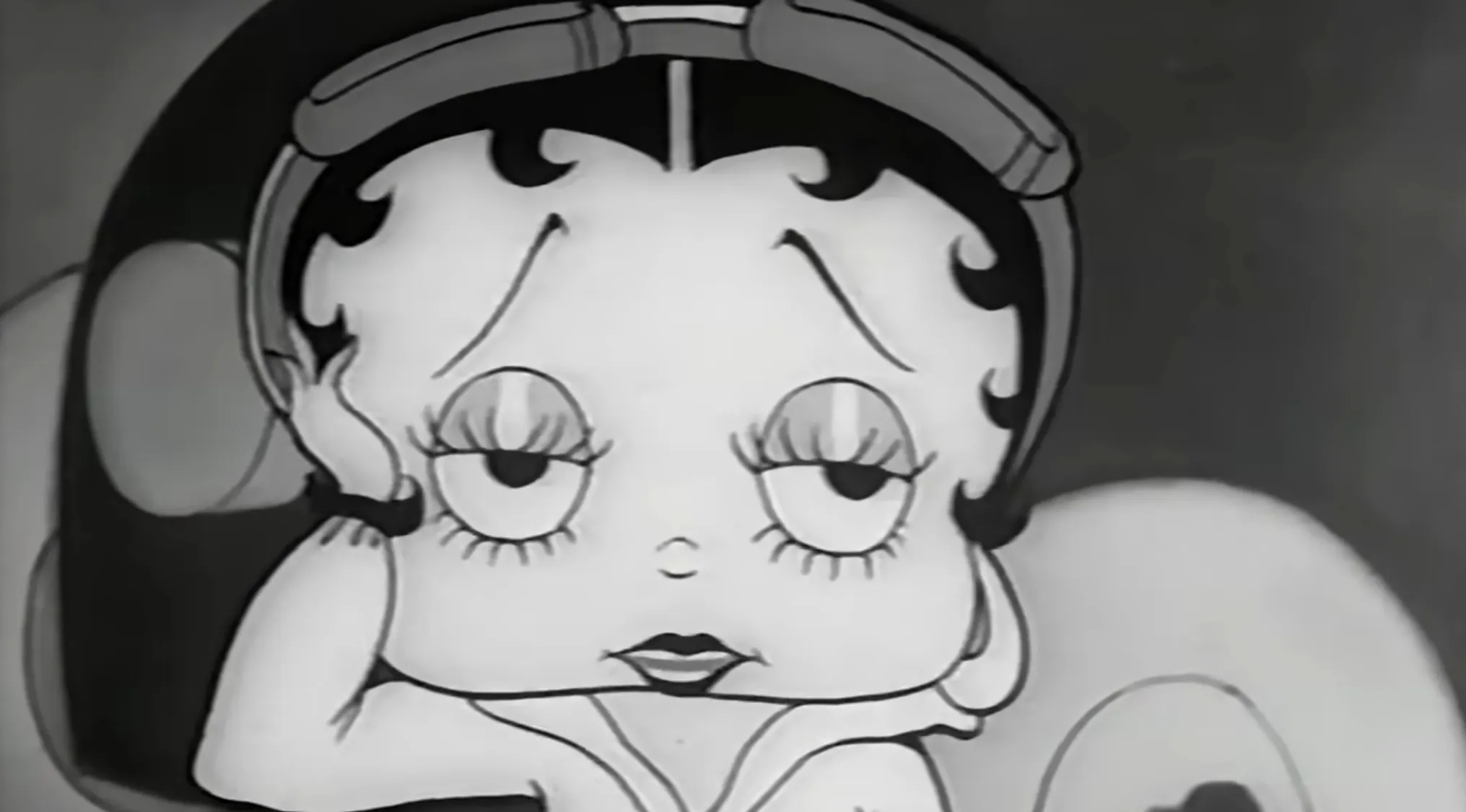 Betty Boop, a classic cartoon character with a melancholic expression.