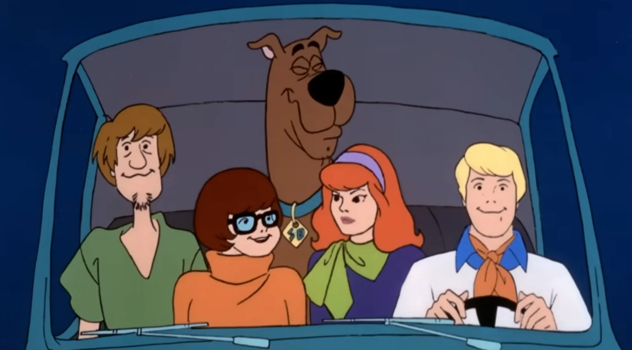 A Saturday Morning Cartoon Trivia image of the Scooby-Doo crew in their Mystery Machine. What is the name of the crew?