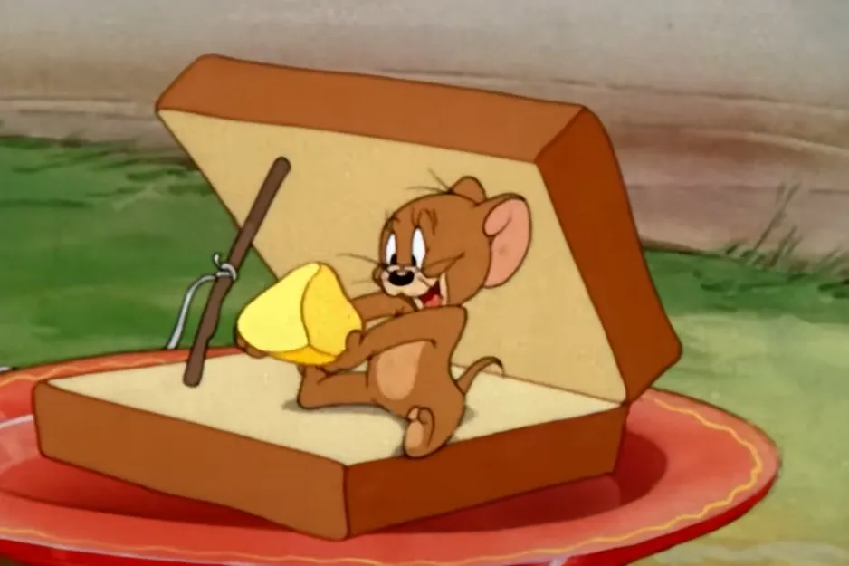 Jerry, the mouse, holding cheese in a trap, from the classic Tom and Jerry cartoon.