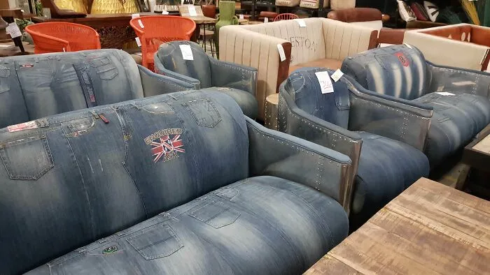 Sofas upholstered with denim fabric, resembling jeans, an example of bizarre furniture design.