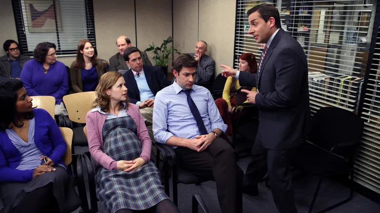 The cast of The Office in a meeting, with Michael Scott speaking, for fans who want to binge The Office.
