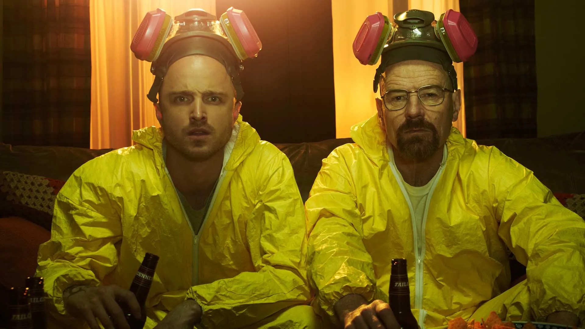 Breaking Bad characters Jesse Pinkman and Walter White in yellow hazmat suits with respirators.