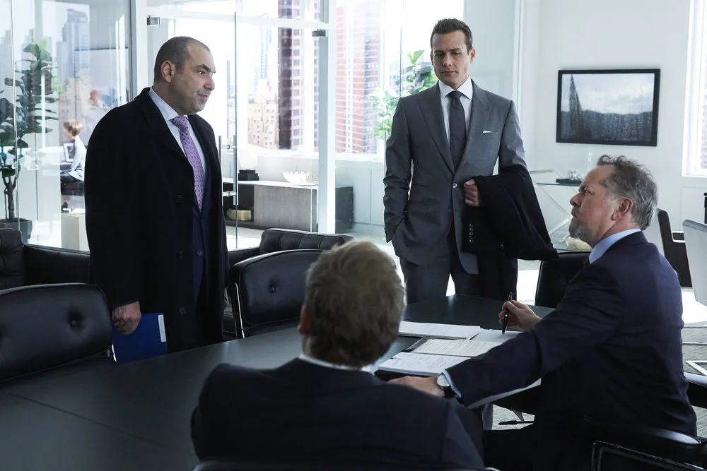 Characters from Suits in a modern office meeting room, for those who pick Suits to binge watch.