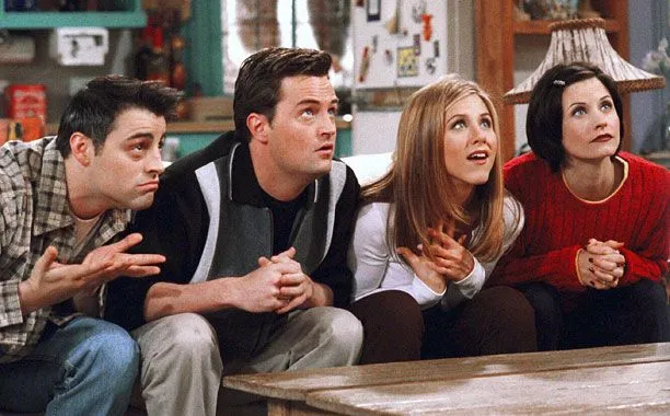 Four Friends characters, Joey, Chandler, Rachel, and Monica, looking up with surprised expressions.