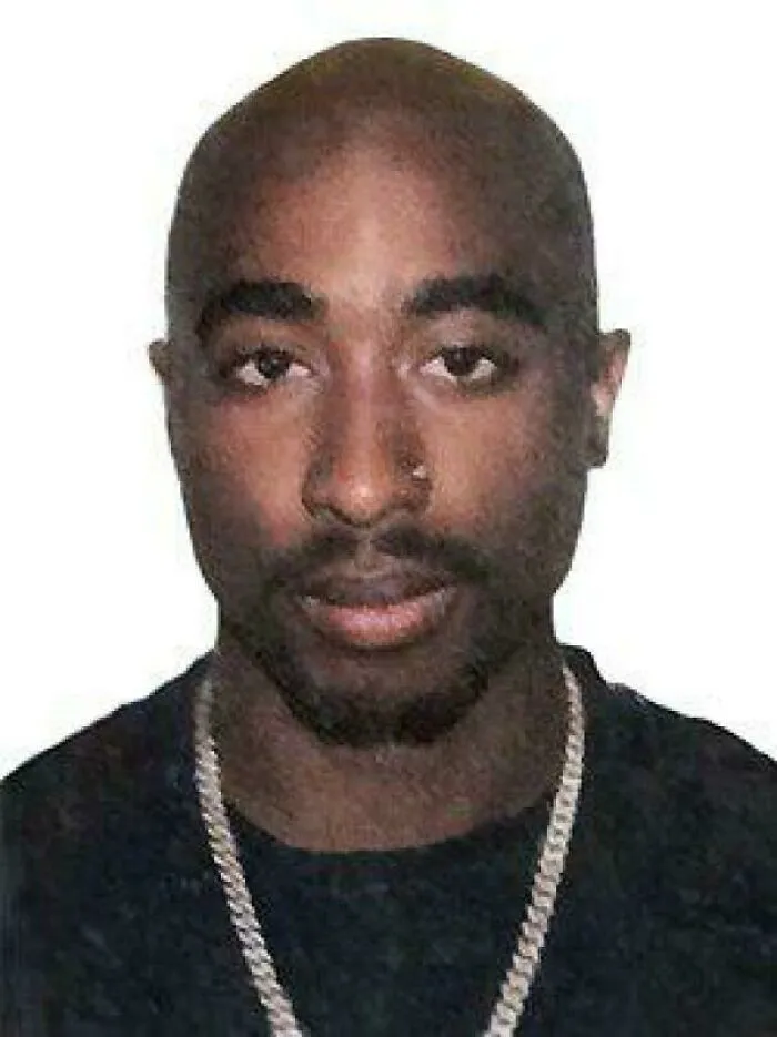 A portrait of Tupac Shakur, a historical figure, prompting a change in sense of history.