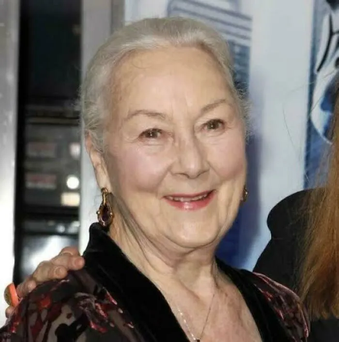 An older woman smiling, contributing to the fascinating timeline facts that change sense of history.