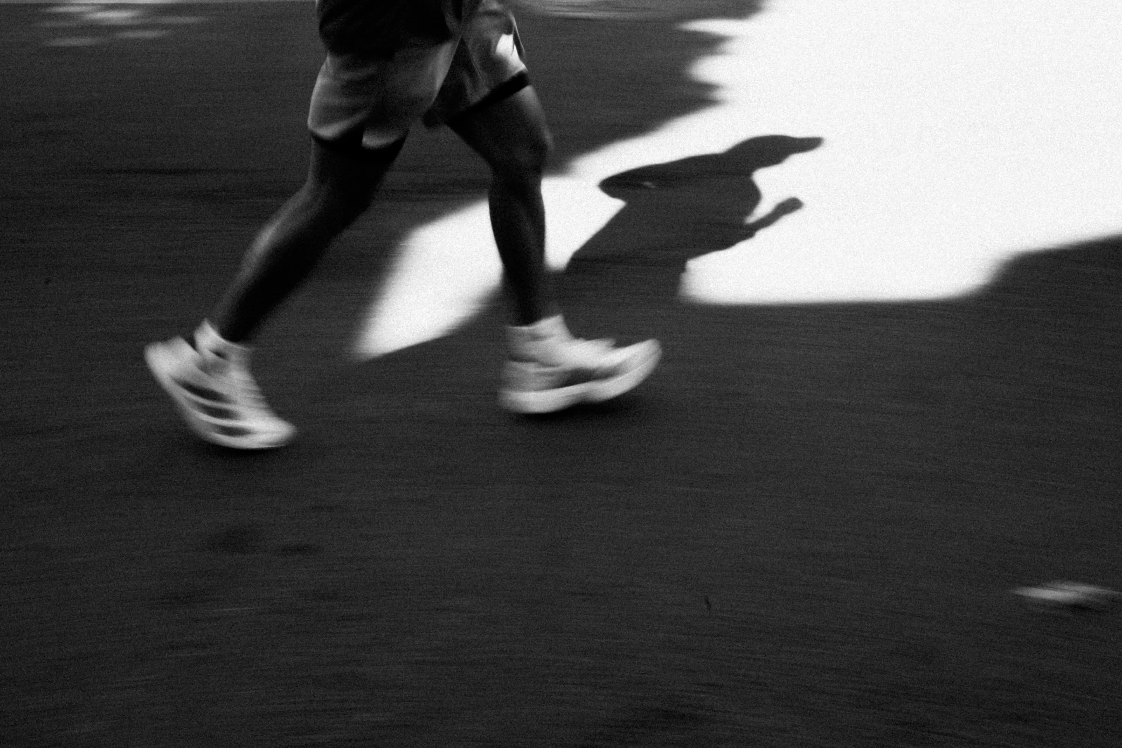 Close up of a person running with blurred motion. Running is a good hobby to master for fitness.