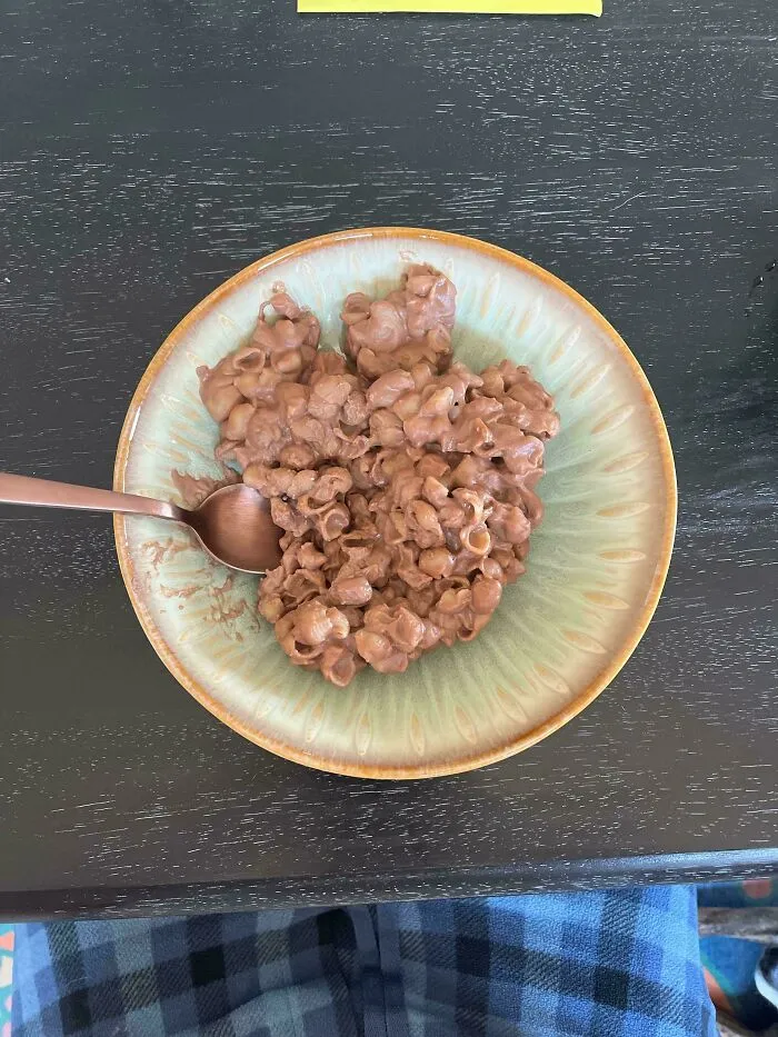 A plate of brown, lumpy, disgusting food resembling a peanut cluster or other confection. Publicly shamed.