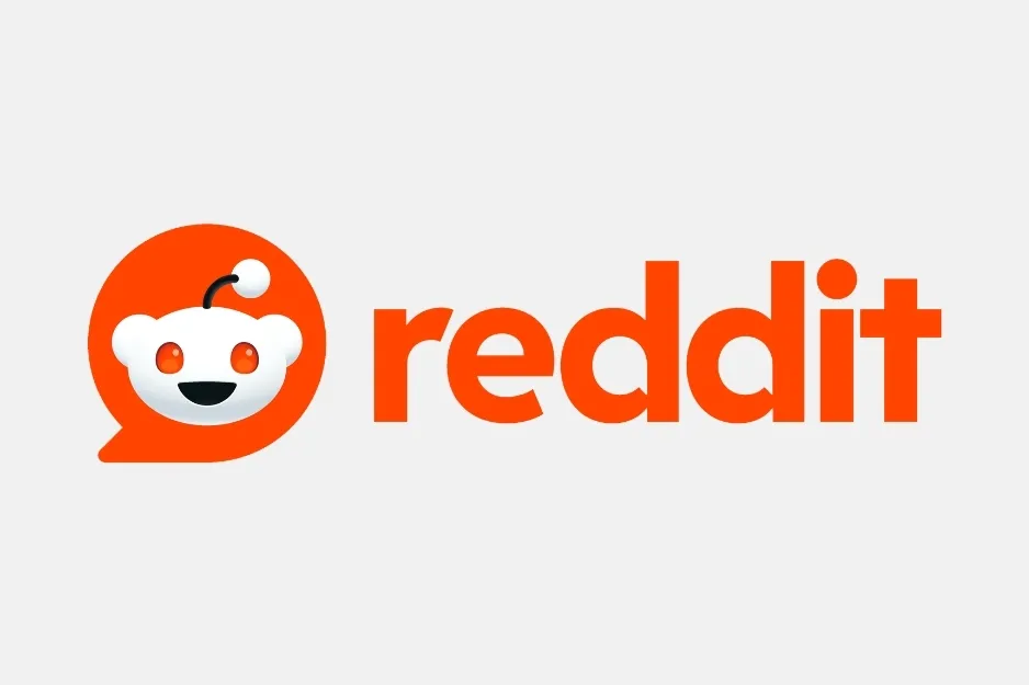 The Reddit logo, featuring the smiling white alien mascot Snoo in an orange speech bubble next to the word reddit, a prominent social media platform.