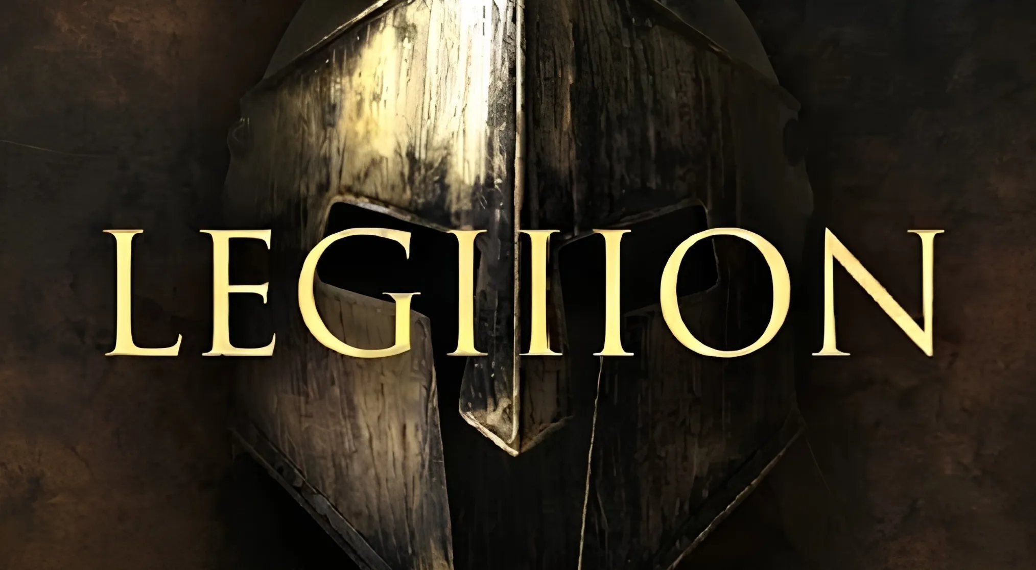 The word LEGION in gold over a worn, dark Spartan helmet. Is this LEGION 2 or LEGION 5? 1% Club question.