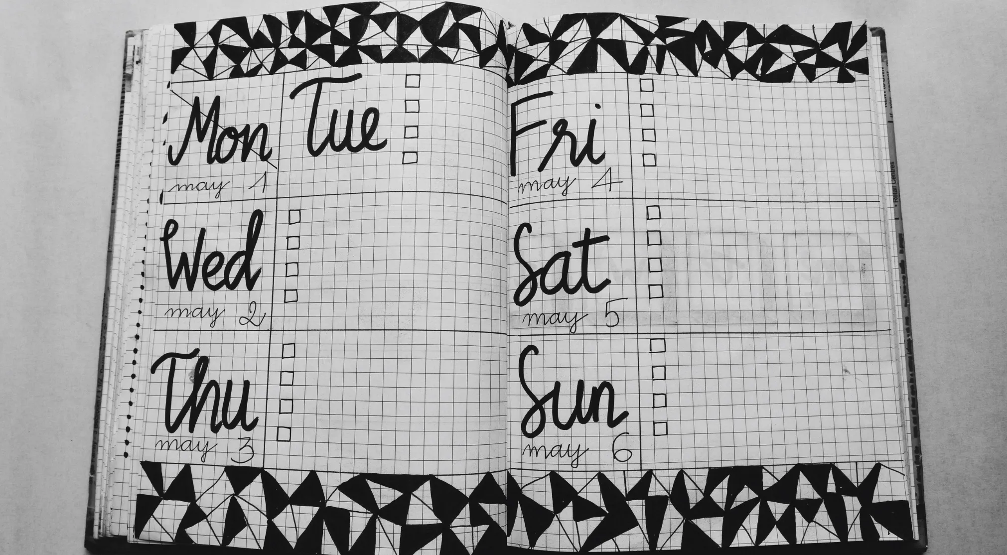 A bullet journal spread, hand-lettered for a week in May, featuring a 15% club question layout.