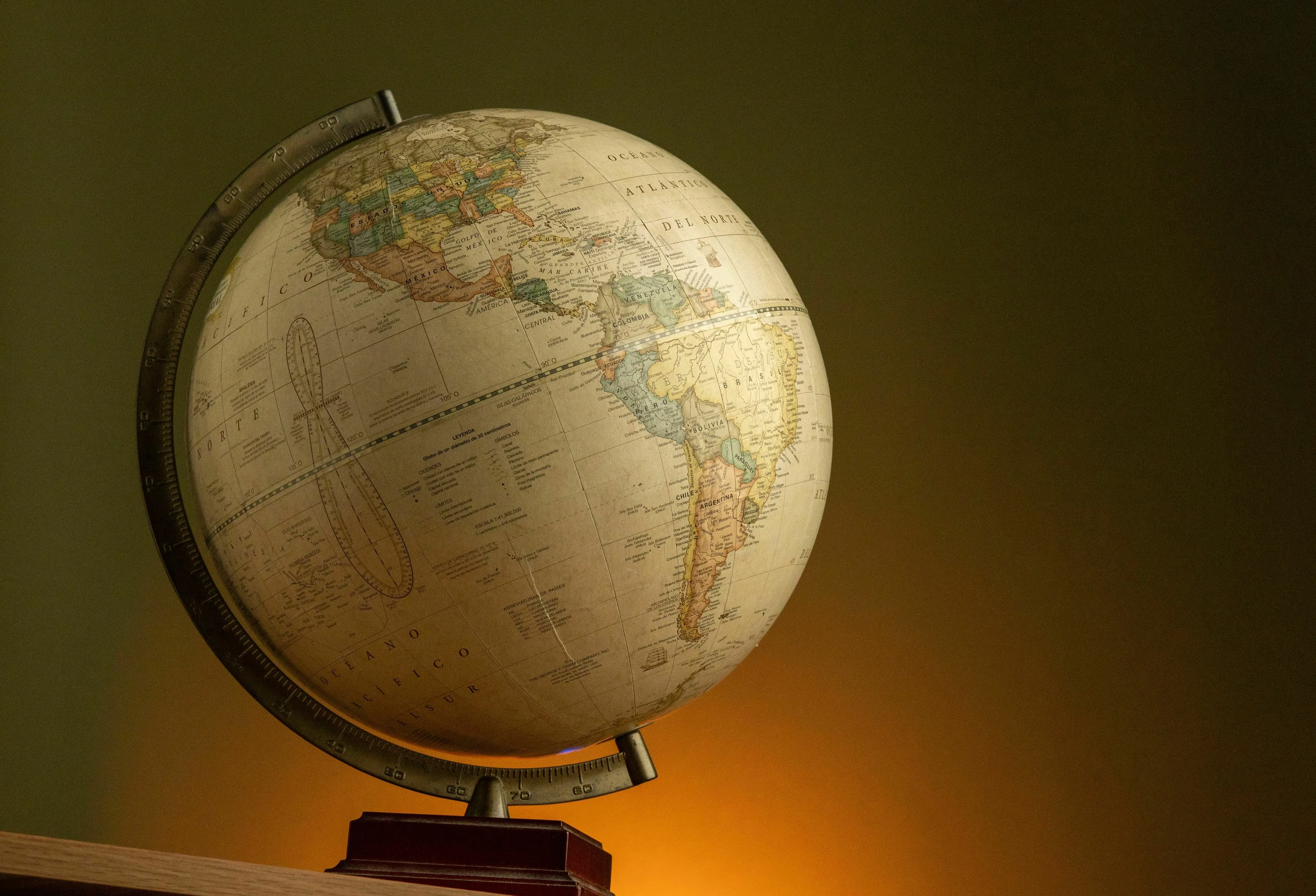 An old-fashioned globe showing continents and countries, providing a general knowledge challenge to find the odd one out.