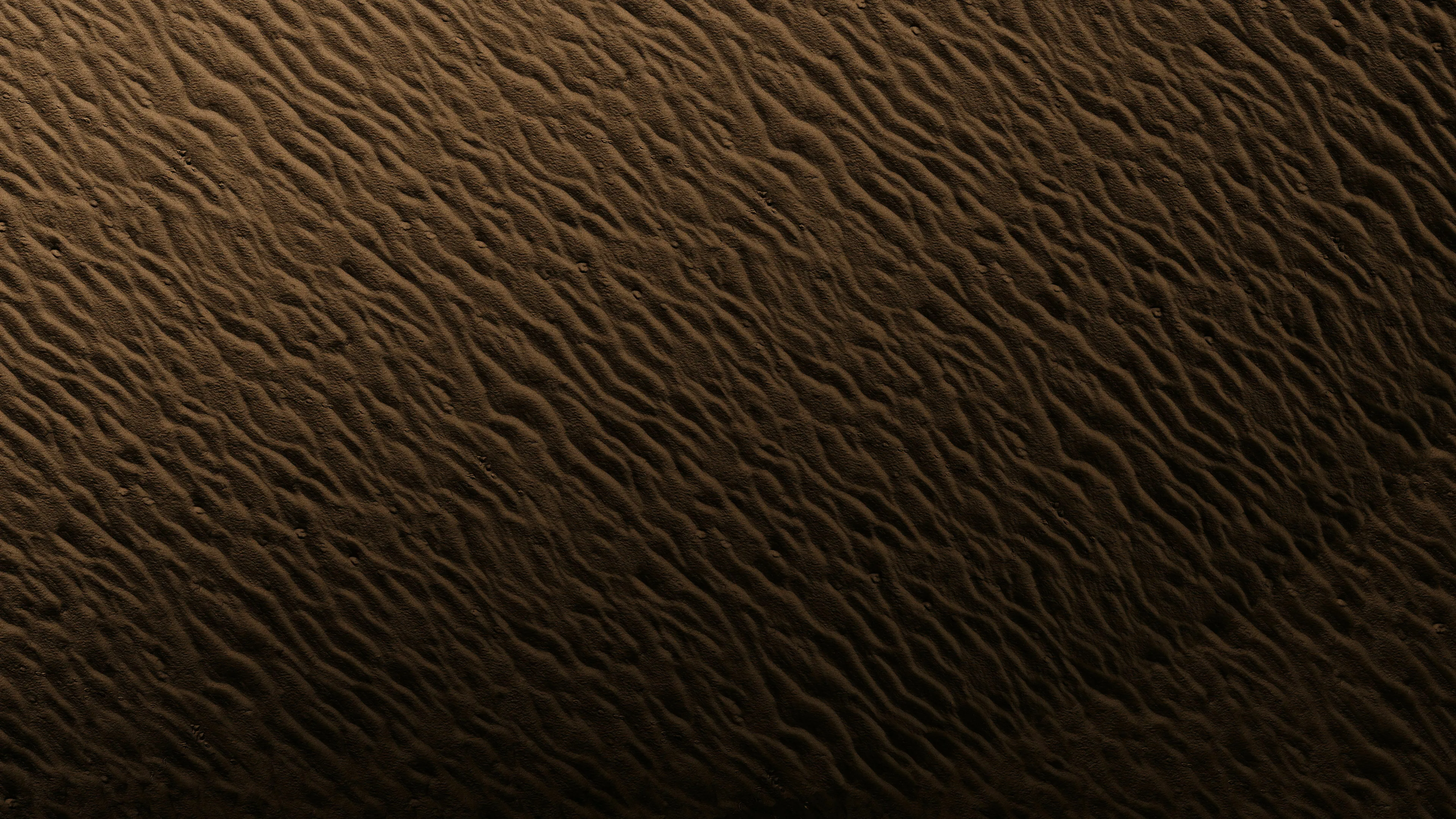 Abstract image of sand ripples for an odd one out general knowledge challenge.