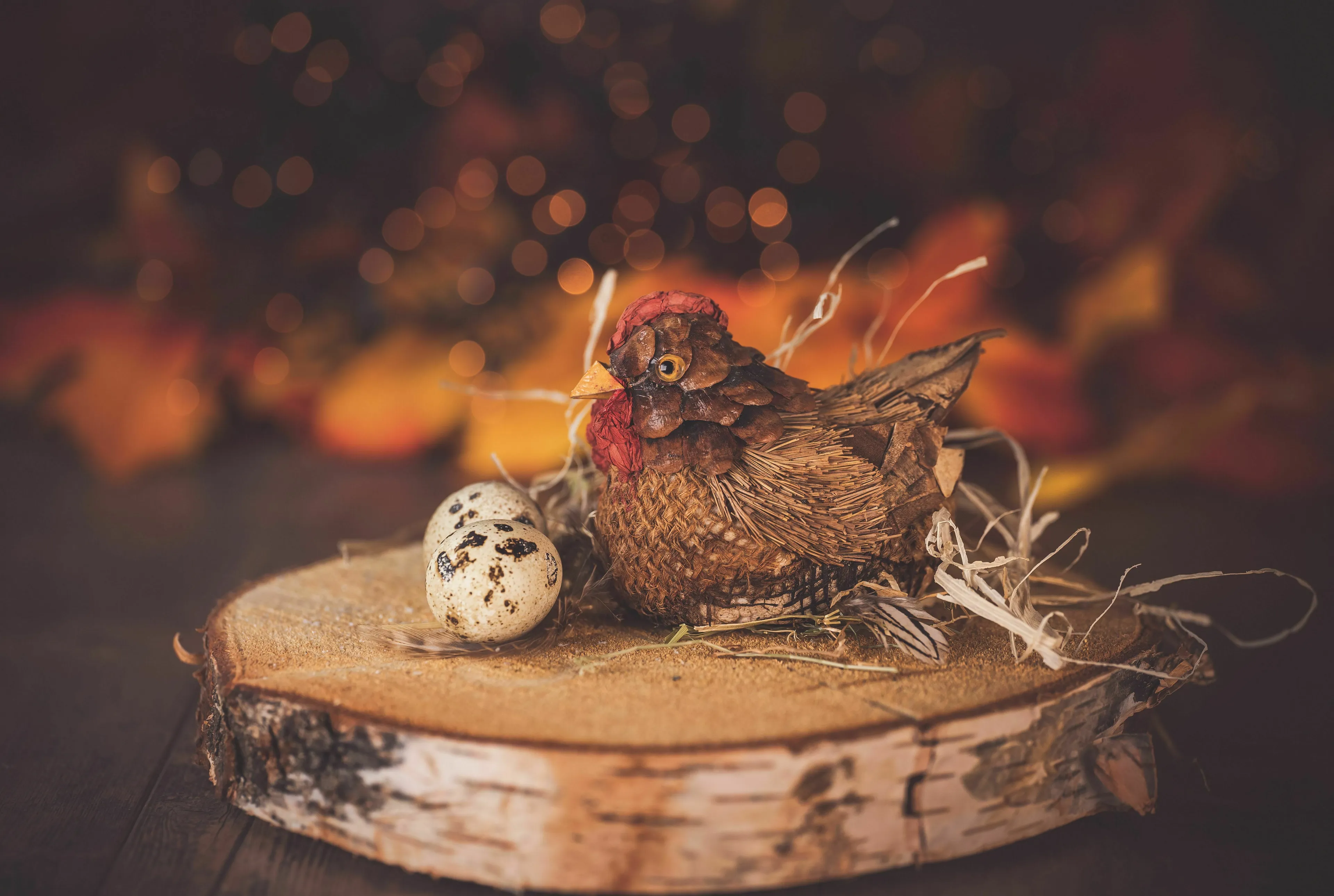 A decorative chicken and an egg on a wooden stump. Answering tricky questions.
