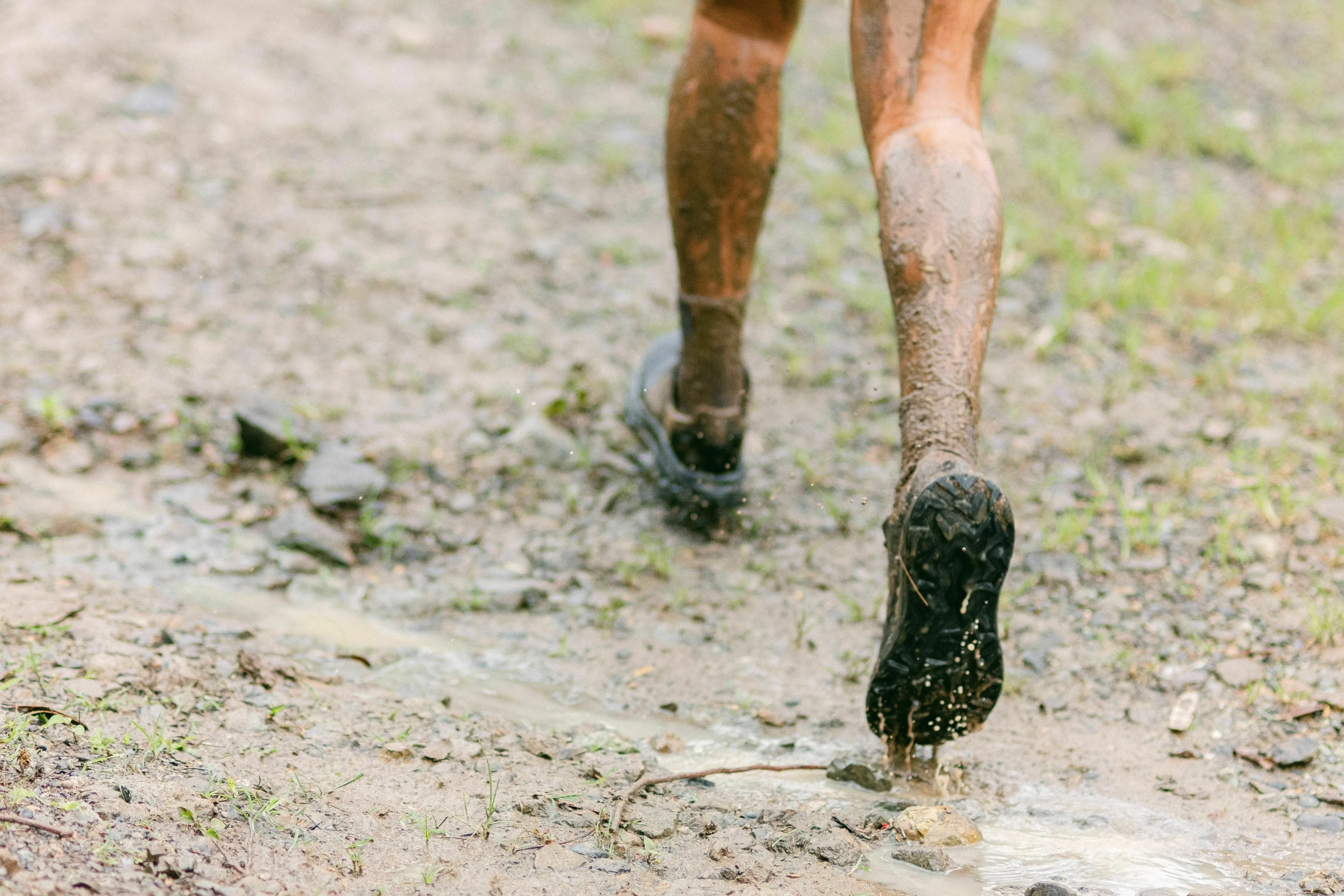 Muddy legs walking on a dirt path. Solving tricky questions about states of matter.