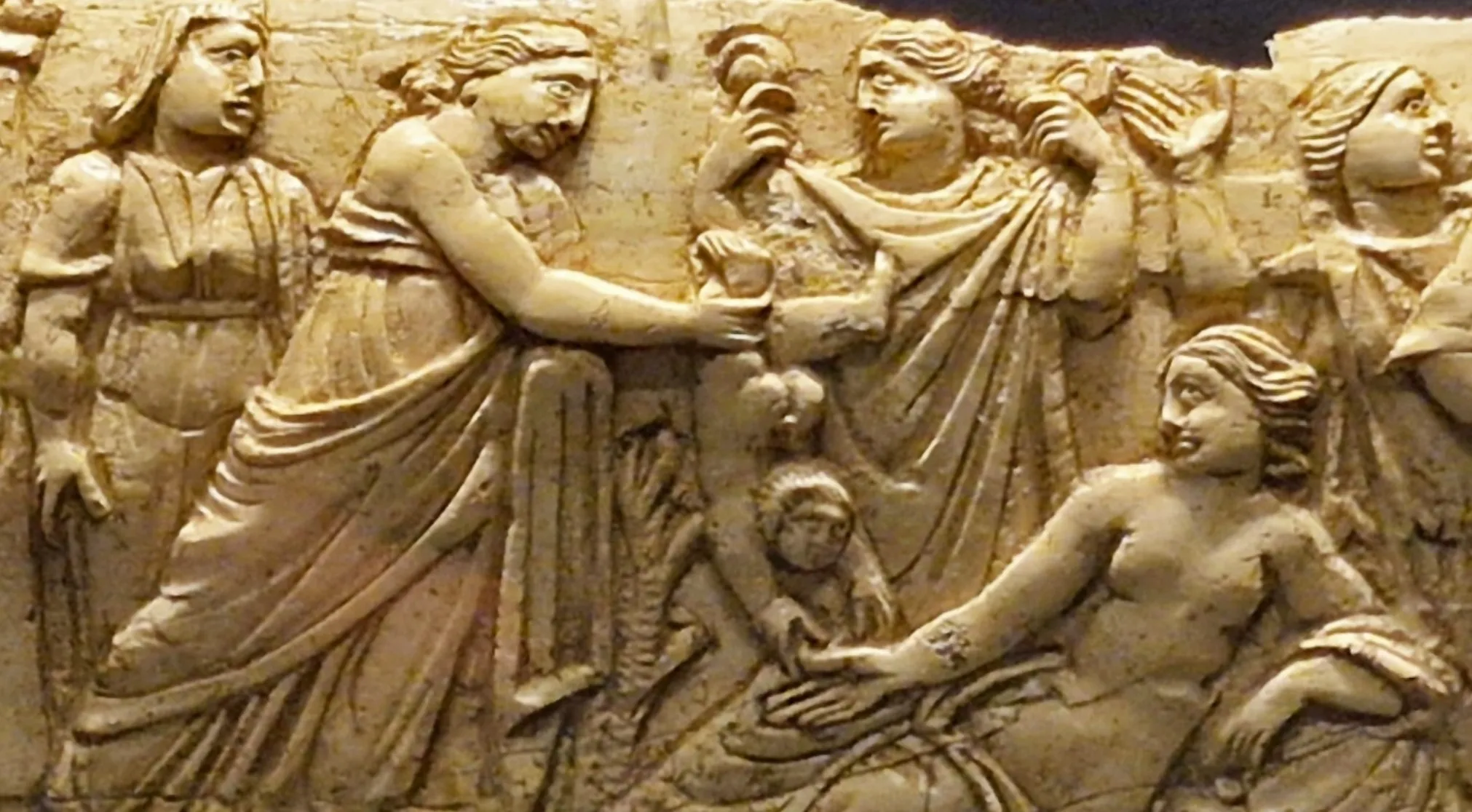 Ancient Greek Mythology relief carving depicting Thetis dipping baby Achilles into the River Styx.