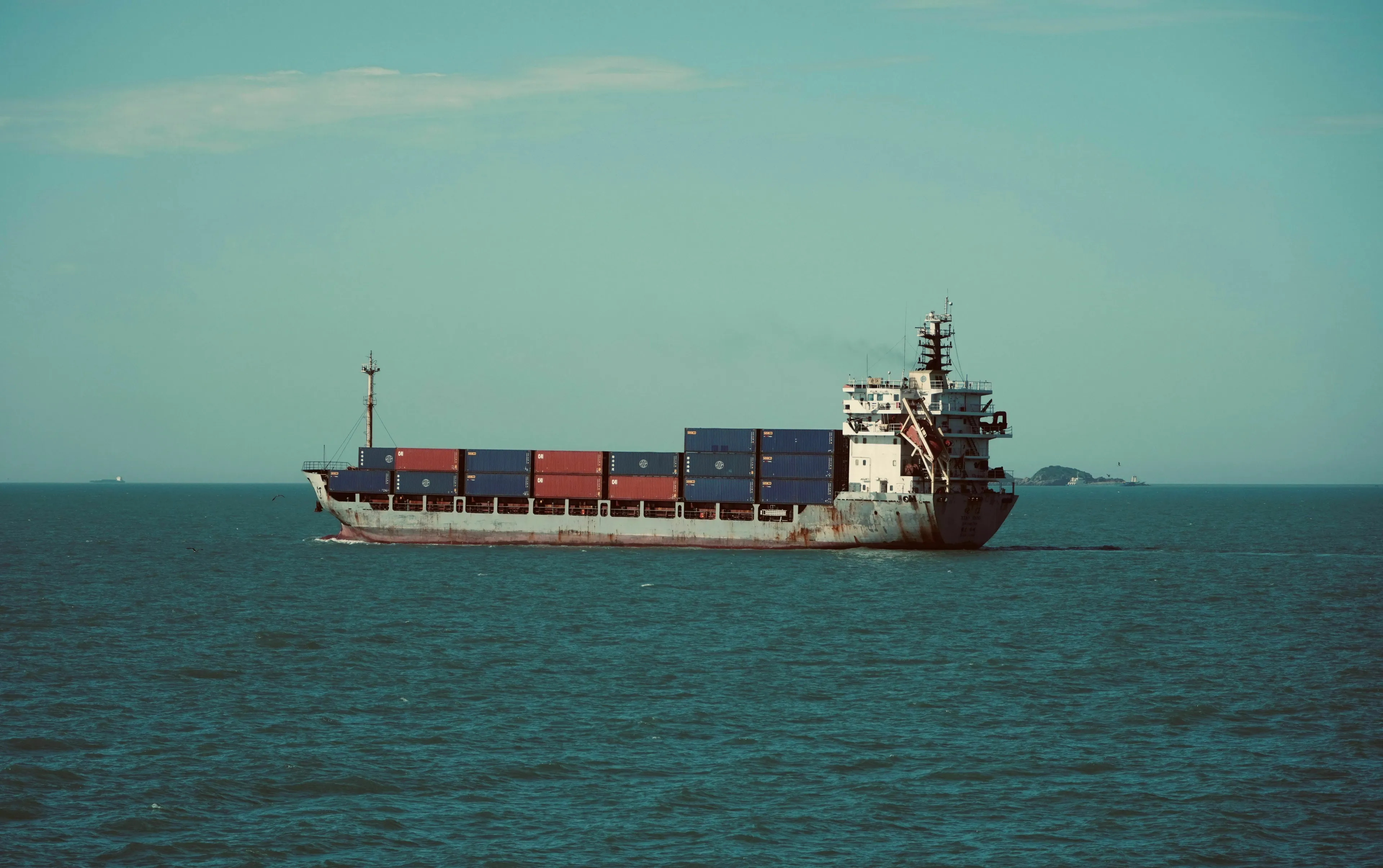 A ship travels through the Panama Canal from the Atlantic to the Pacific Ocean, sailing in a specific compass direction.