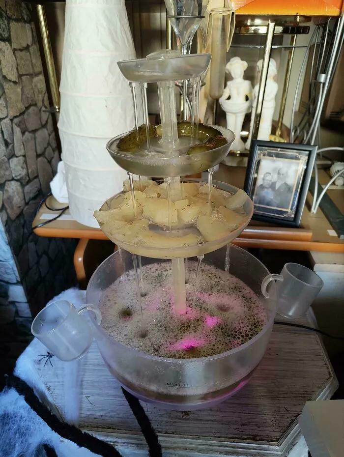 A party drink fountain filled with pickles and pickle juice as a questionable food combo.