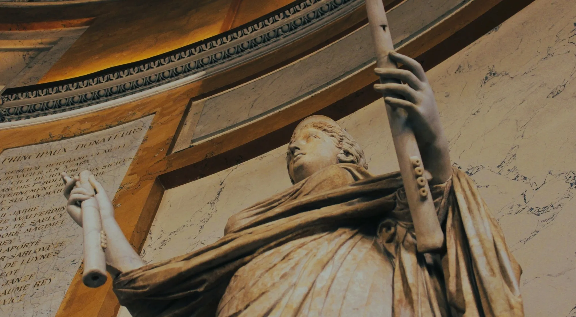 Ancient Civilizations marble statue, possibly from the first democracy, holding flutes, viewed from below in a grand hall.