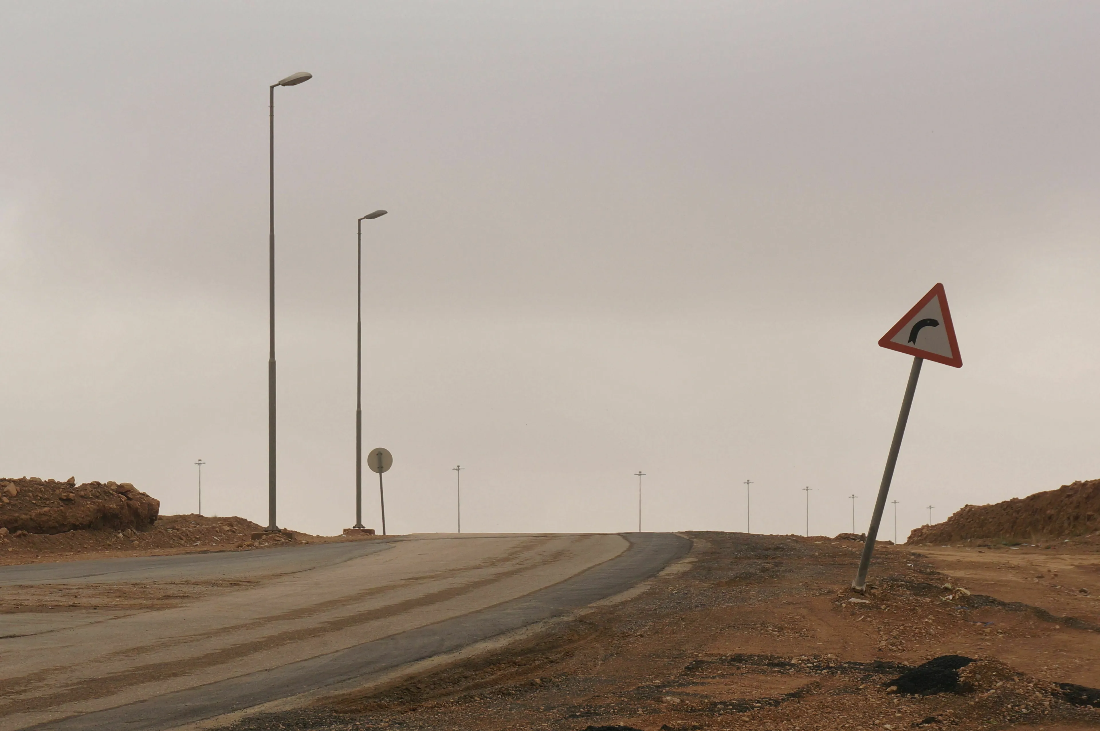 A road sign points to a shortcut that requires sacrifice on a mythological quest.