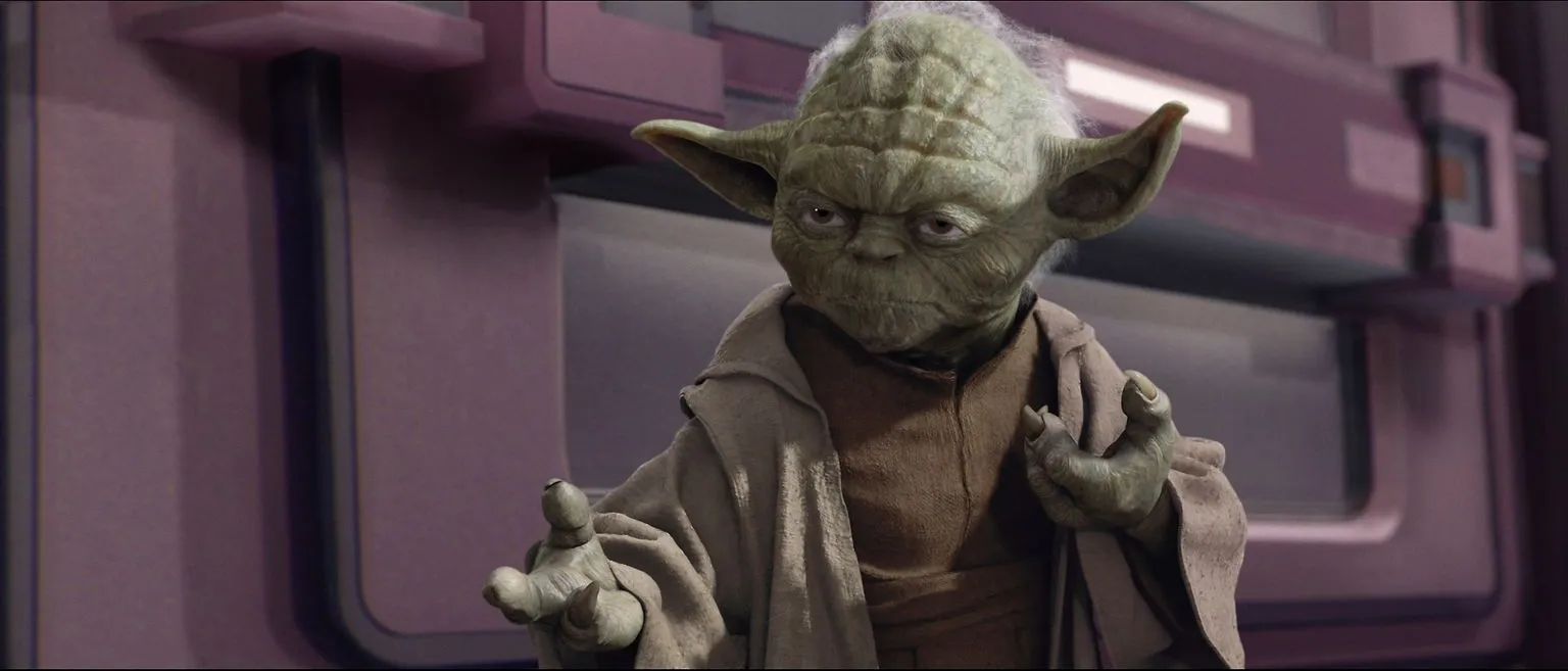 Yoda, a fictional mentor, gesturing with his hands, displaying his wisdom and power.