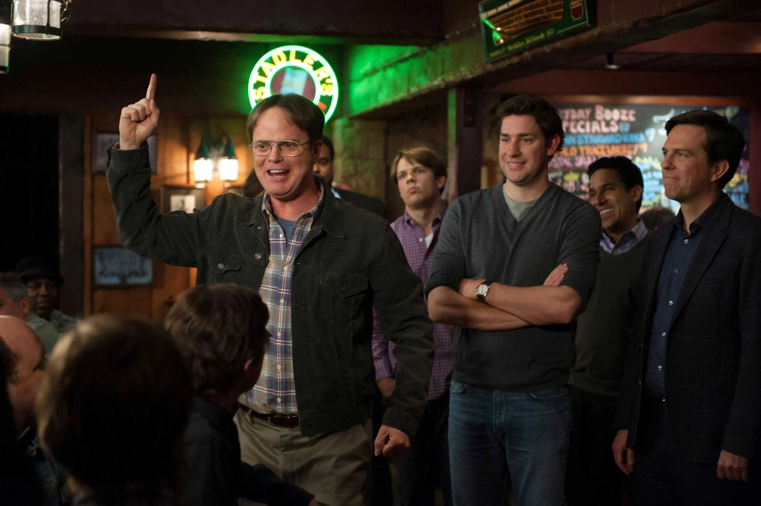 Dwight Schrute and Jim Halpert from The Office in a bar, picking a comfort show.