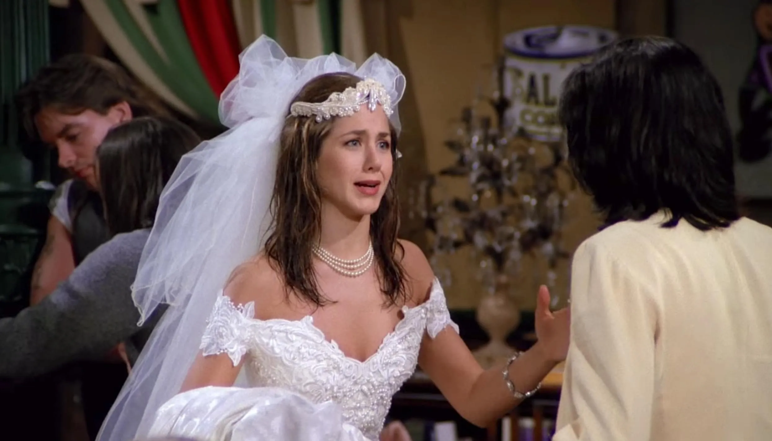 Rachel Green in a wedding dress from Friends, picking a comfort show to have on.