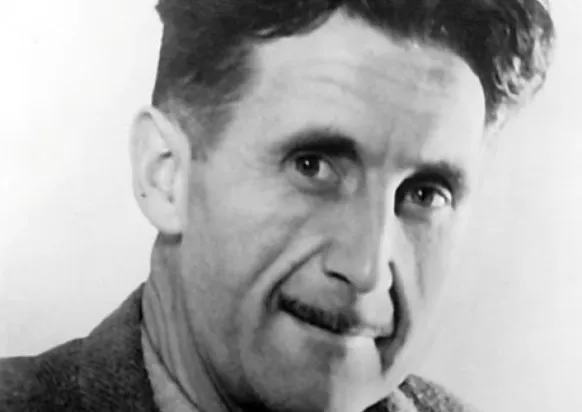 George Orwell, the author of the novel 1984, in a black and white close-up portrait.