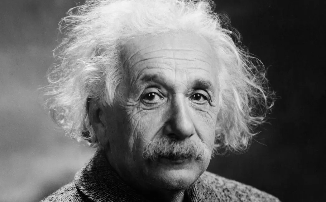 A black and white portrait of Albert Einstein, the famous scientist known for his theories.