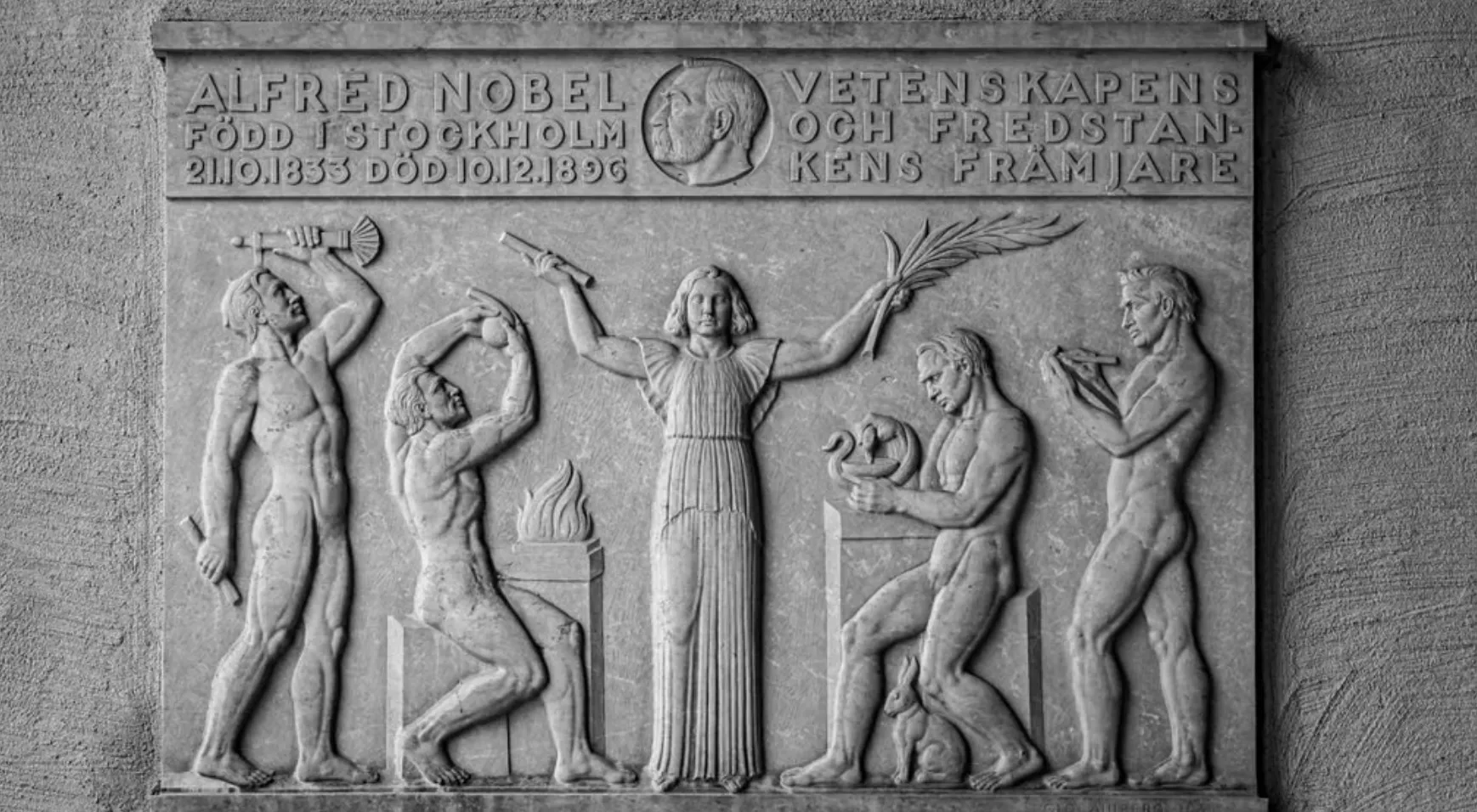 A black and white relief sculpture of Alfred Nobel, a general knowledge challenge odd one out