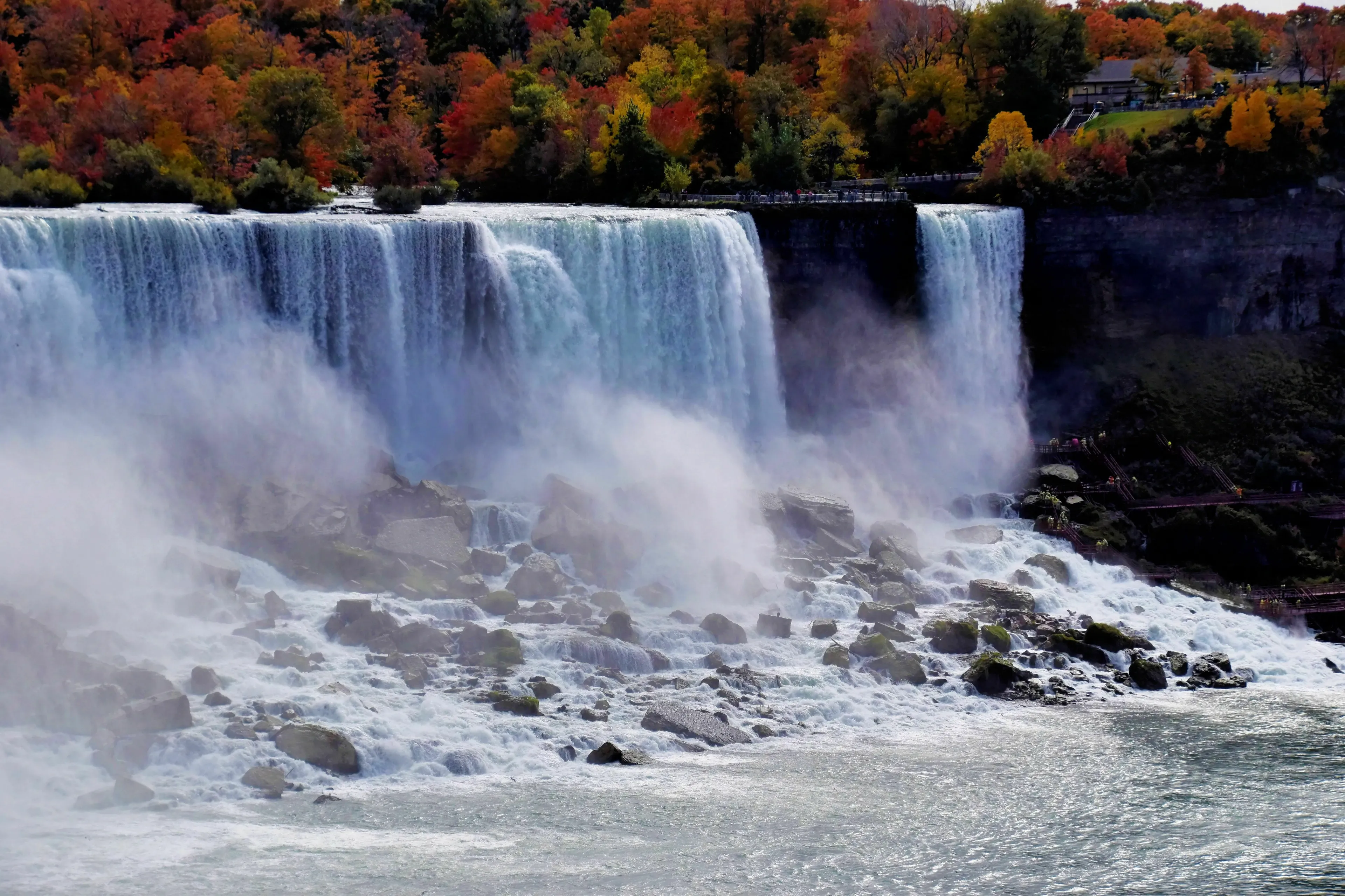 Majestic waterfalls with autumn trees in the background, a geography quiz question.