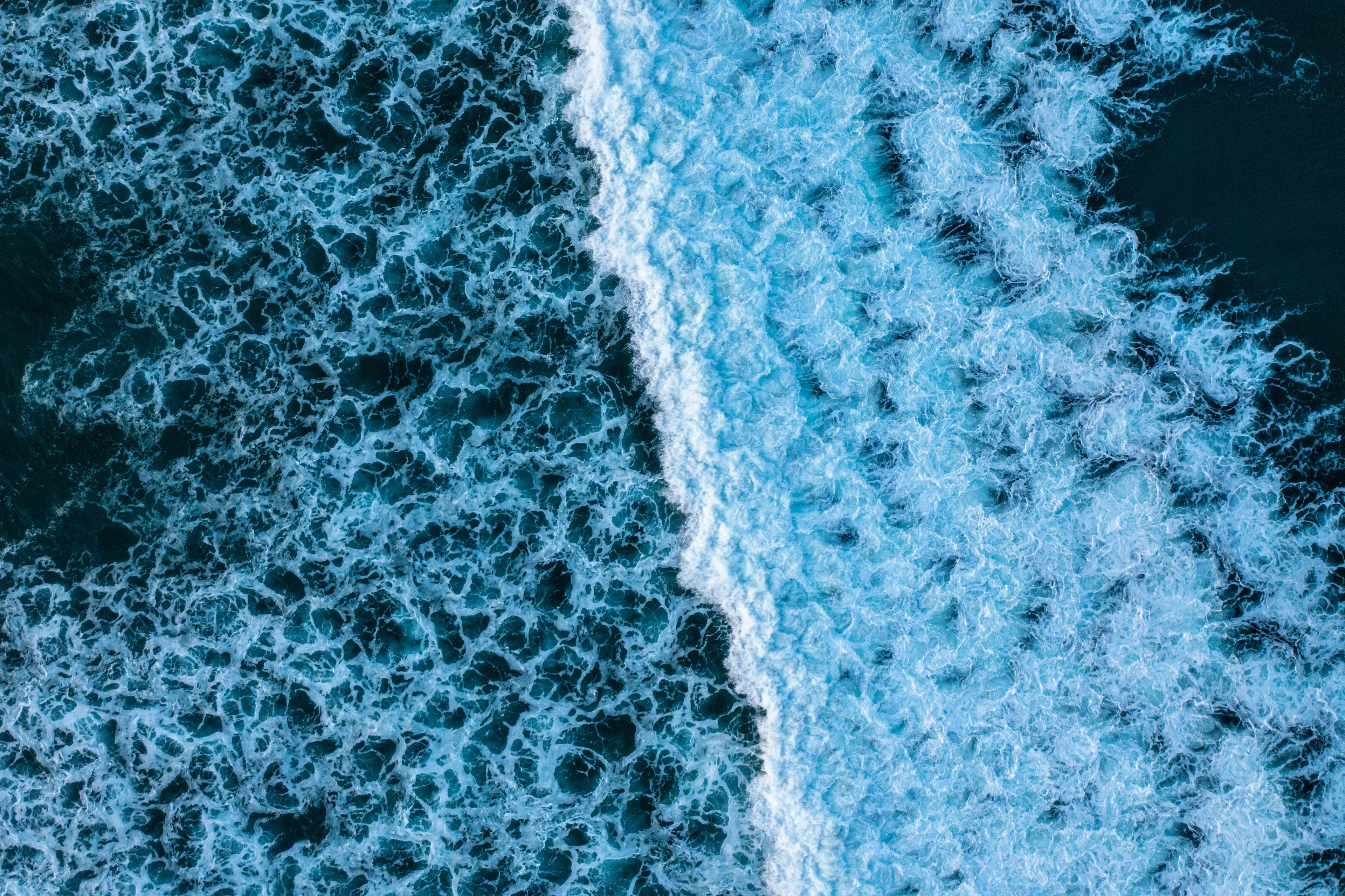 Aerial view of ocean waves, illustrating a question about the smallest ocean in a geography quiz.