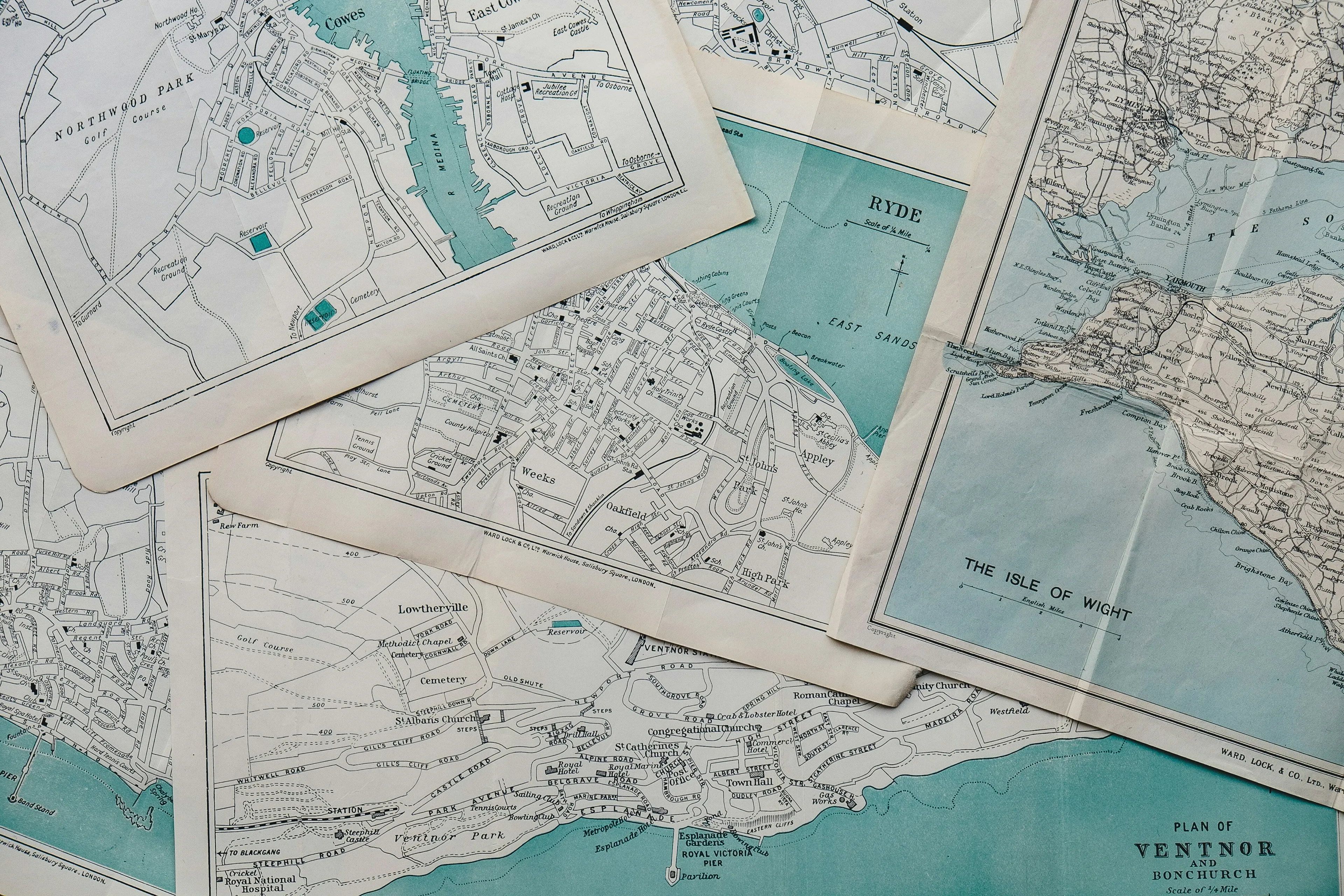 A collection of old maps, illustrating the study of maps and map-making, for a geography knowledge quiz.