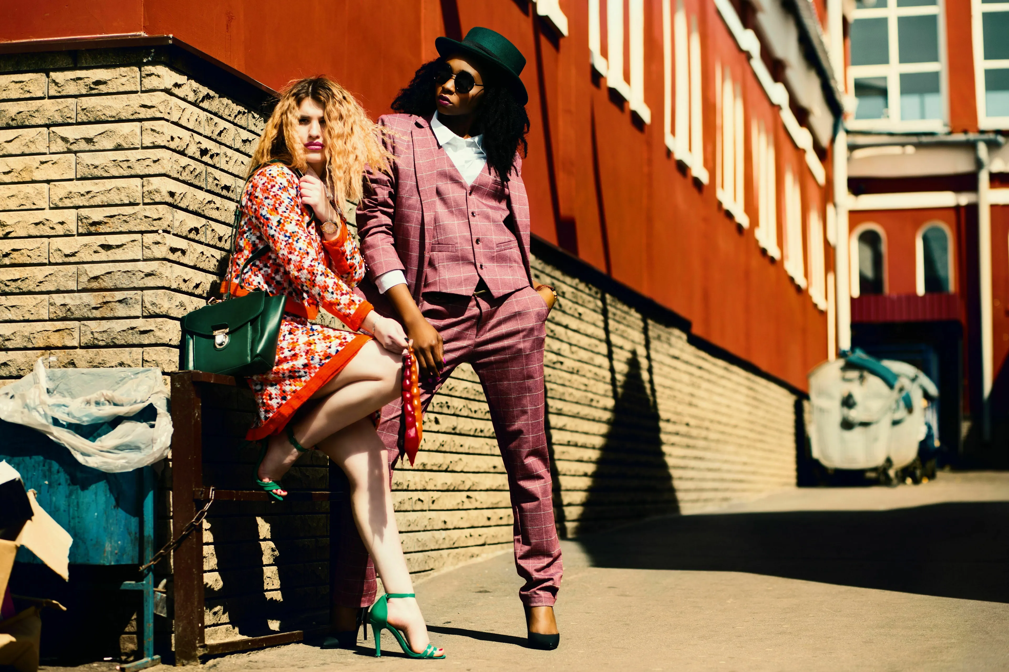 Two stylish people in unique outfits, exploring your relationship with fashion across different decades.