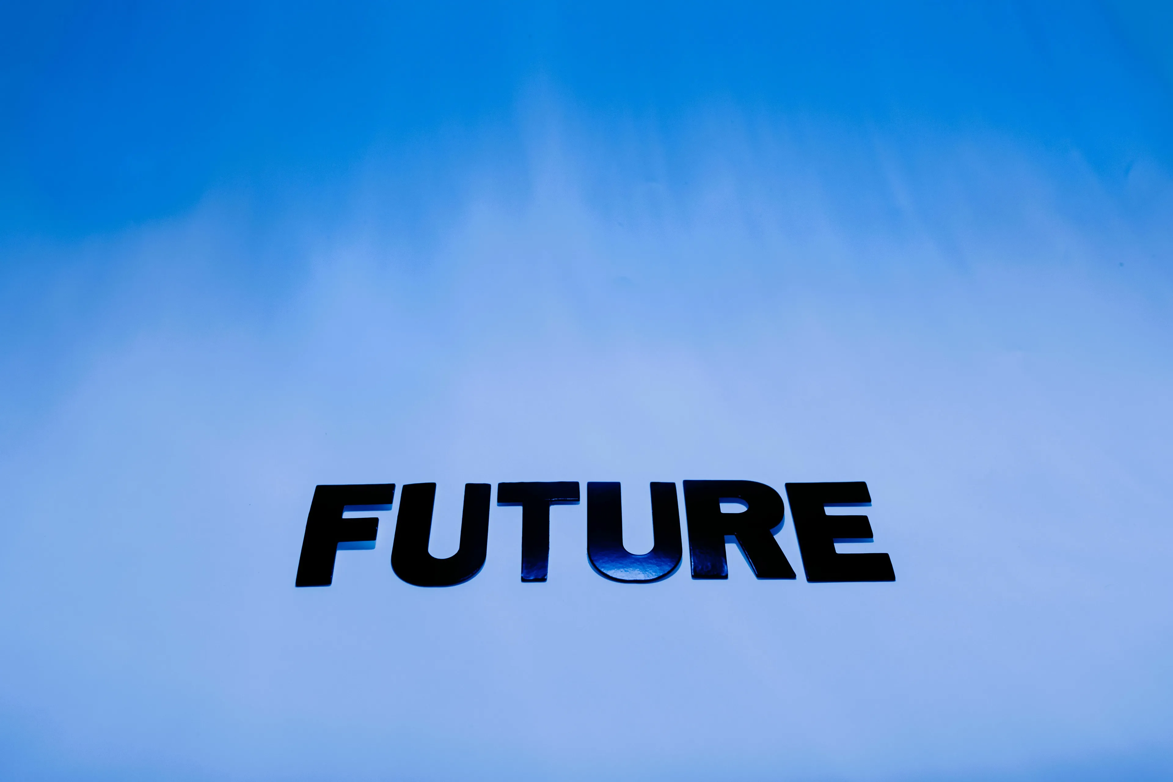 The word FUTURE in bold, black letters against a bright blue background, representing feelings about the future.