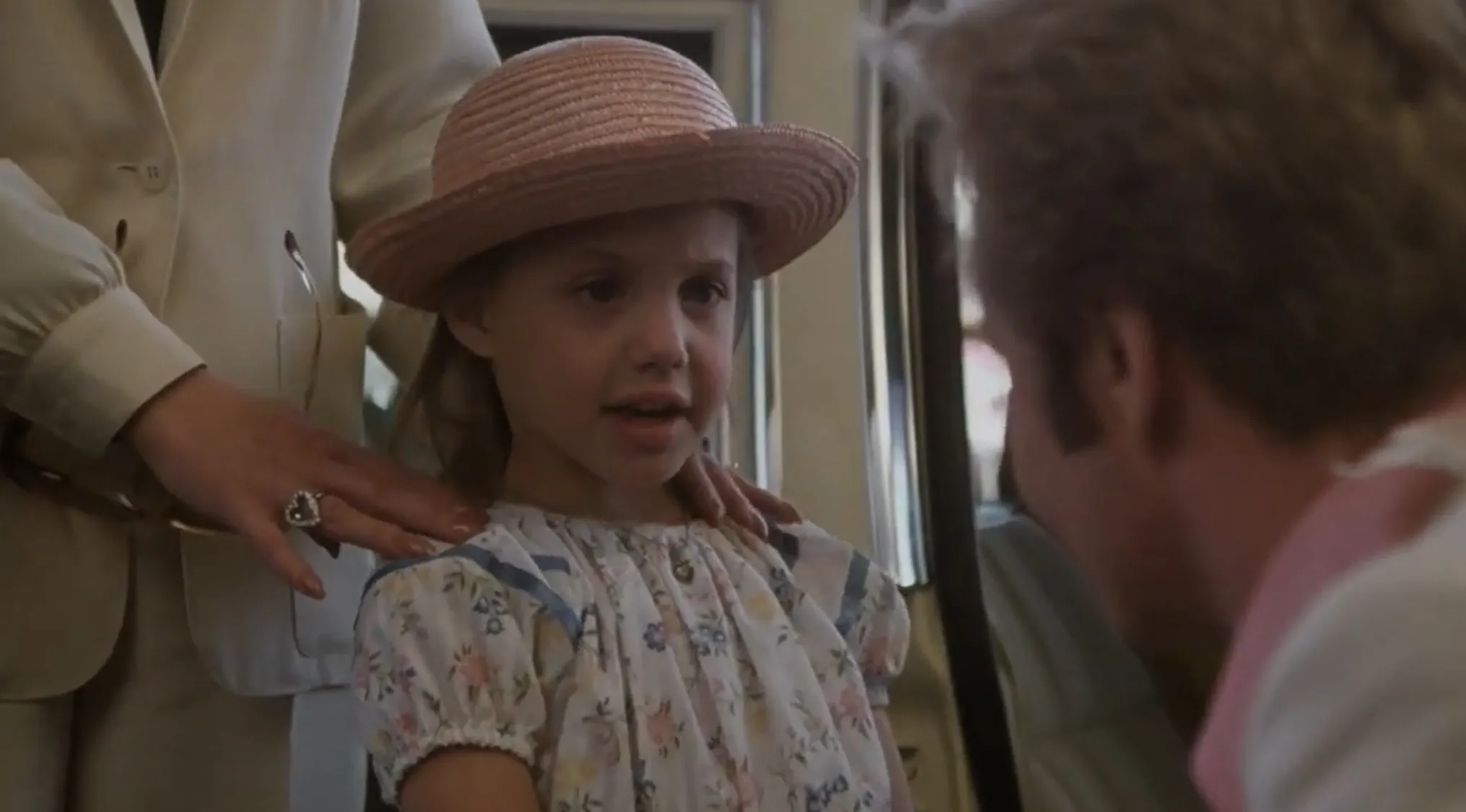 A young girl in a hat, making her film debut, in the Famous People Before The Fame series.