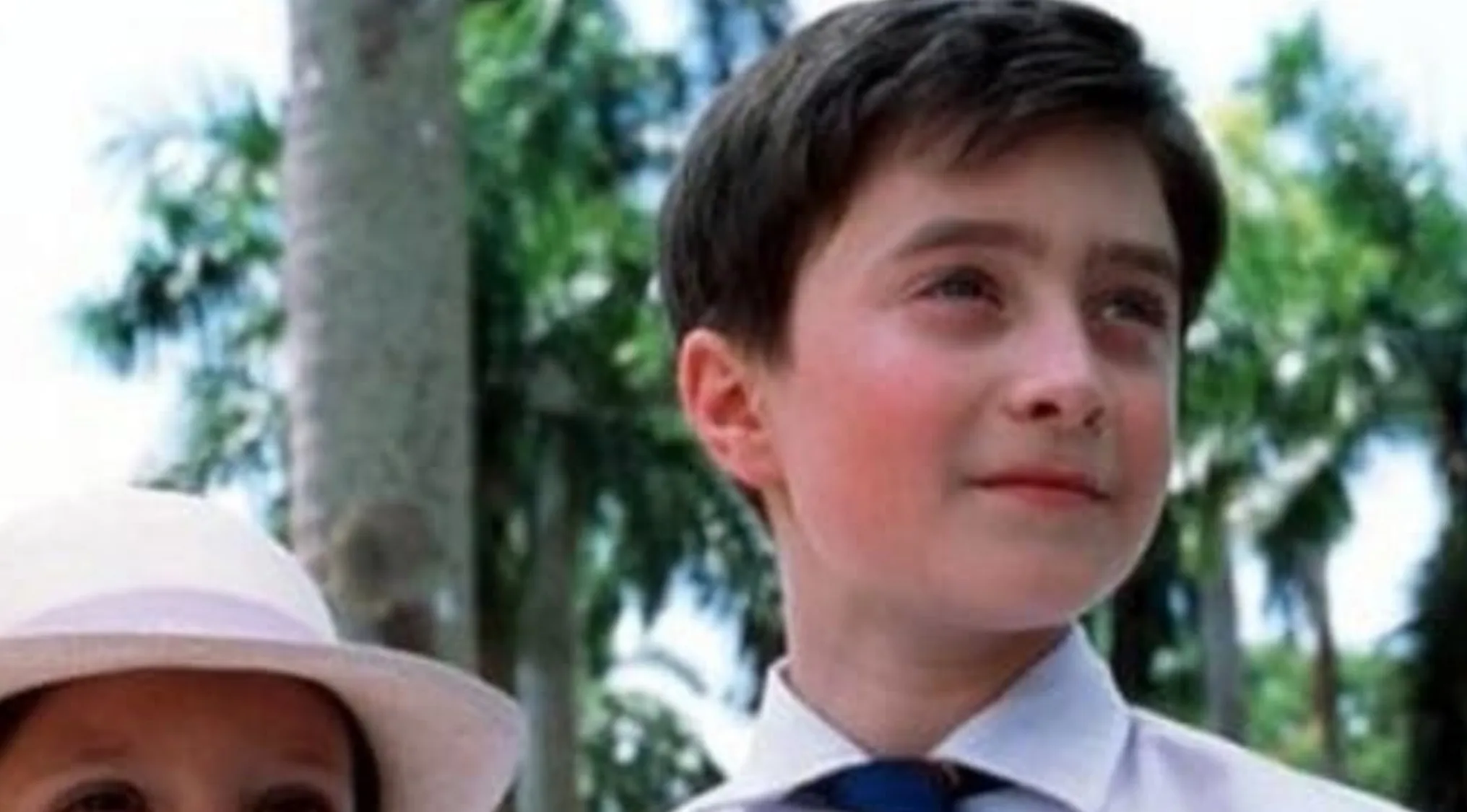 A young boy in a blue tie and white shirt, before the fame, begins a successful career.