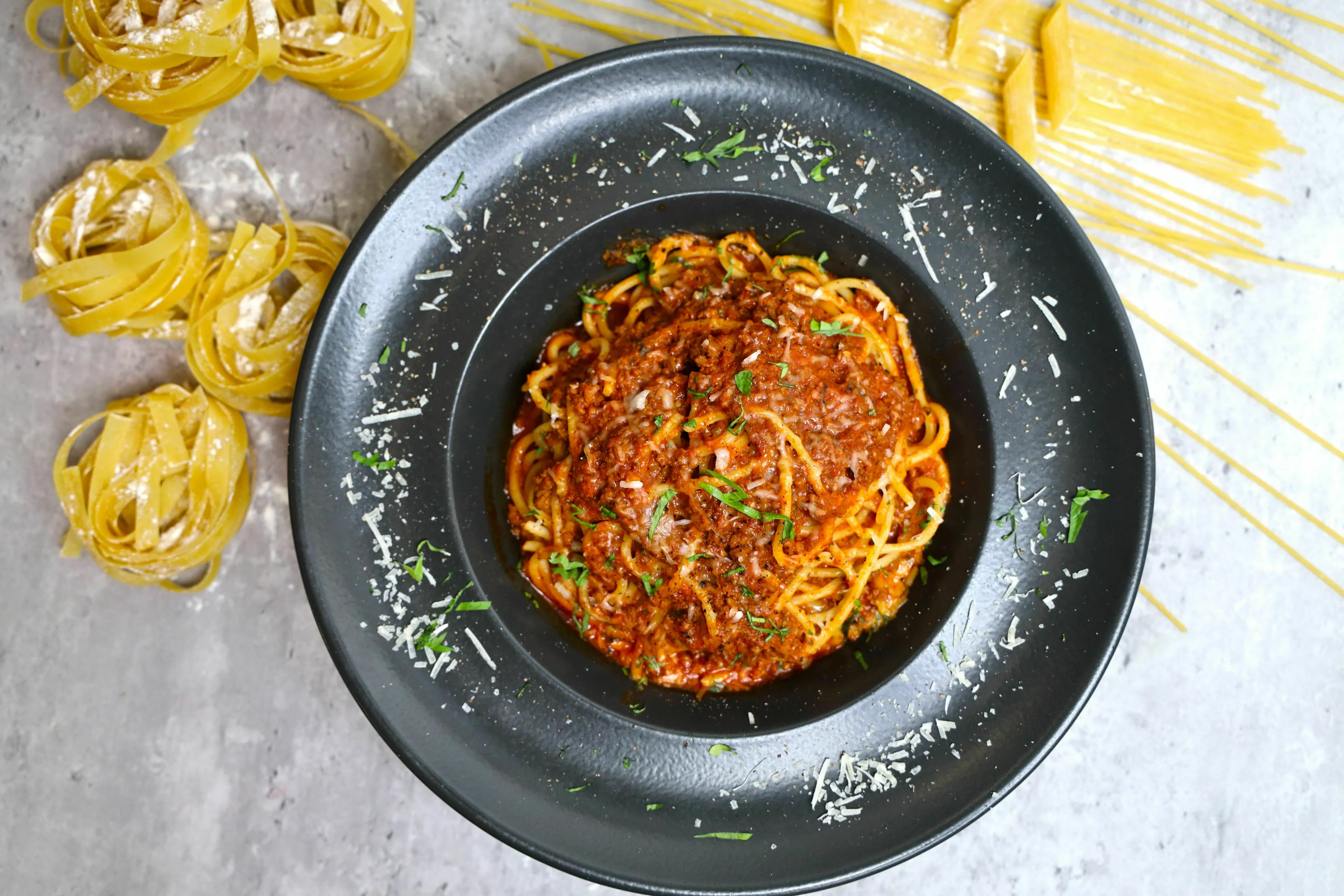 A delicious plate of spaghetti bolognese, a classic Italian meat dish for an English words quiz.