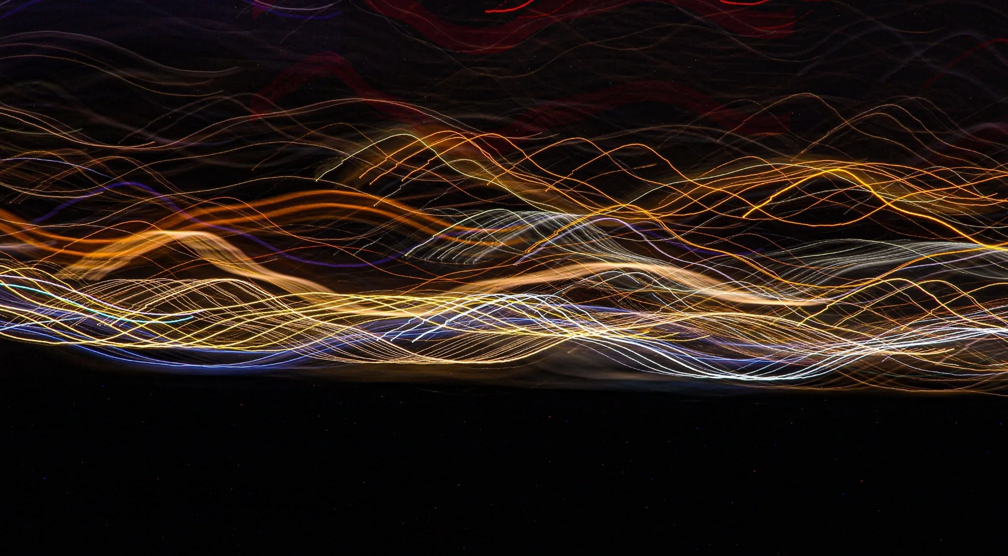 Abstract light trails, symbolizing electromagnetic spectrum wavelengths and shortest wavelength concepts. Would FBI hire you?