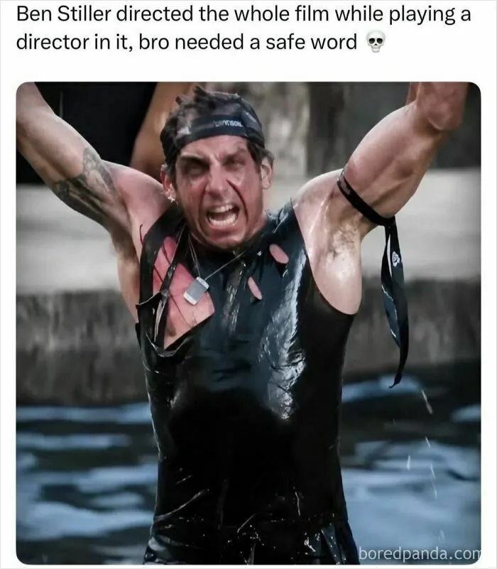 Ben Stiller as a director in a movie scene, yelling with arms raised while wet and covered in mud.