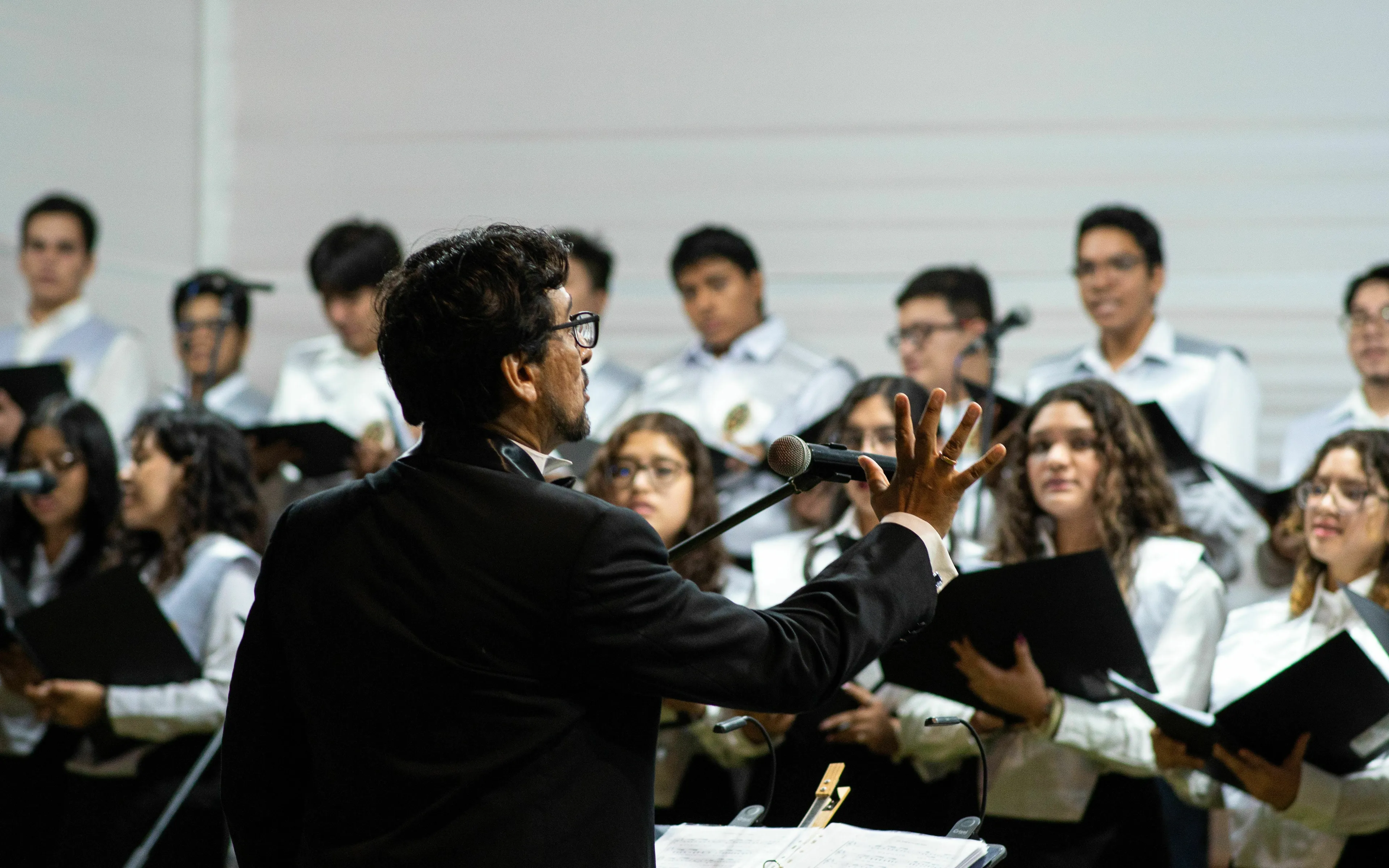 Classical Music Quiz: a choir conductor leading a group, reminiscent of Handel's Hallelujah Chorus.