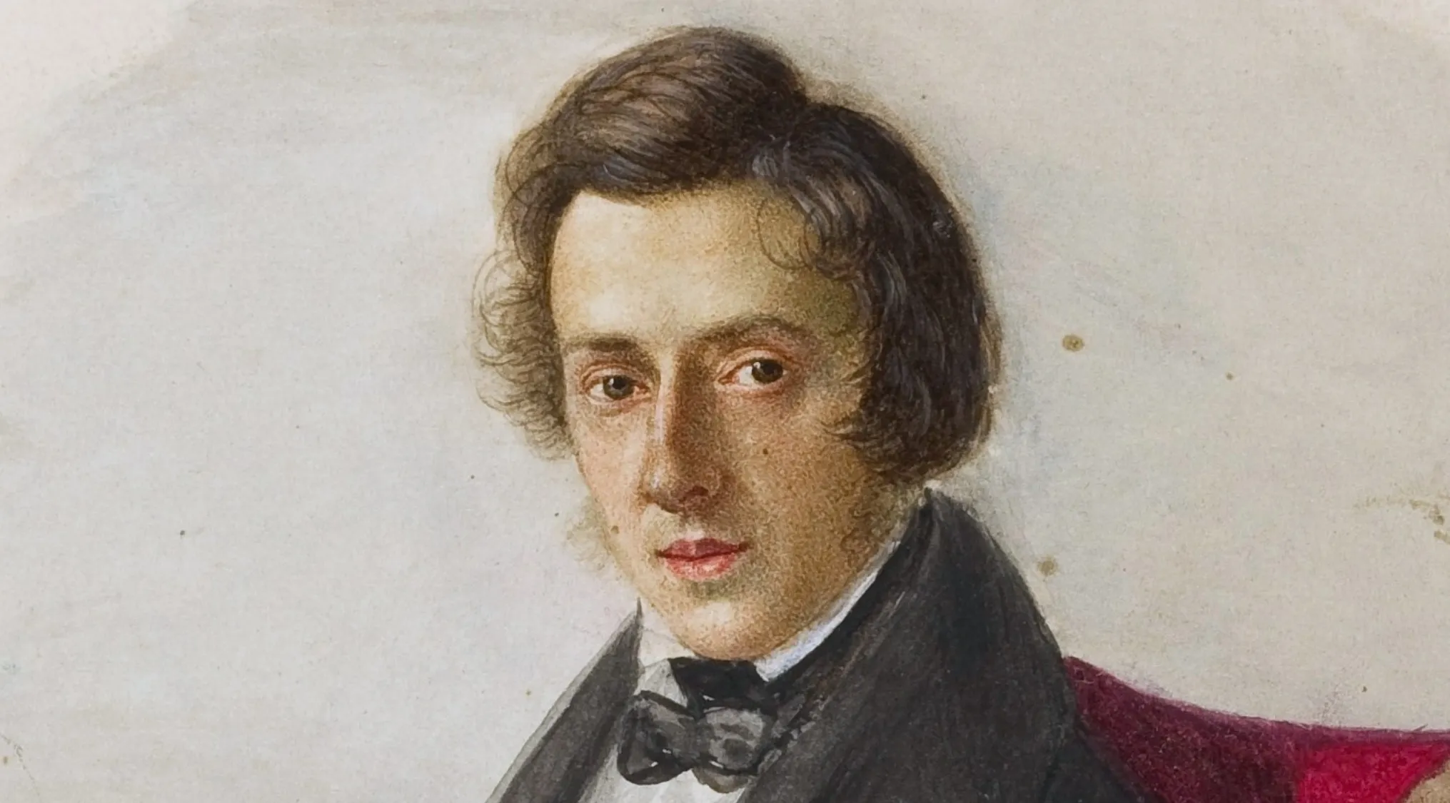 A watercolor portrait of Frédéric Chopin, a famous classical music composer. He is depicted from the chest up, wearing a black suit and bow tie, with a dark red background. His hair is dark brown and wavy, framing a youthful face with serious eyes and full lips. The painting style is soft and detailed.
