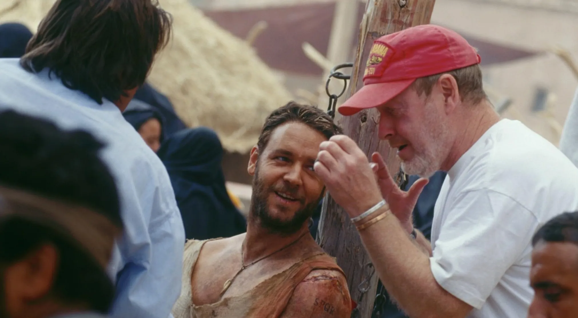 BTS image of Russell Crowe with a director, discussing a scene. Guess the movie from this BTS shot.