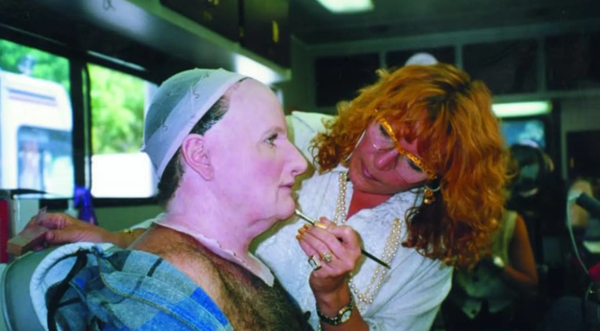 A behind-the-scenes image showing makeup being applied to a person, guessing the movie from this BTS image.