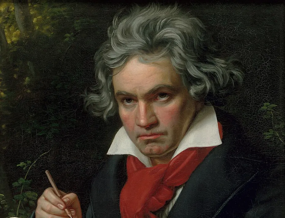Portrait of Ludwig van Beethoven with gray hair and a red scarf, writing with a quill, against a dark, leafy background.