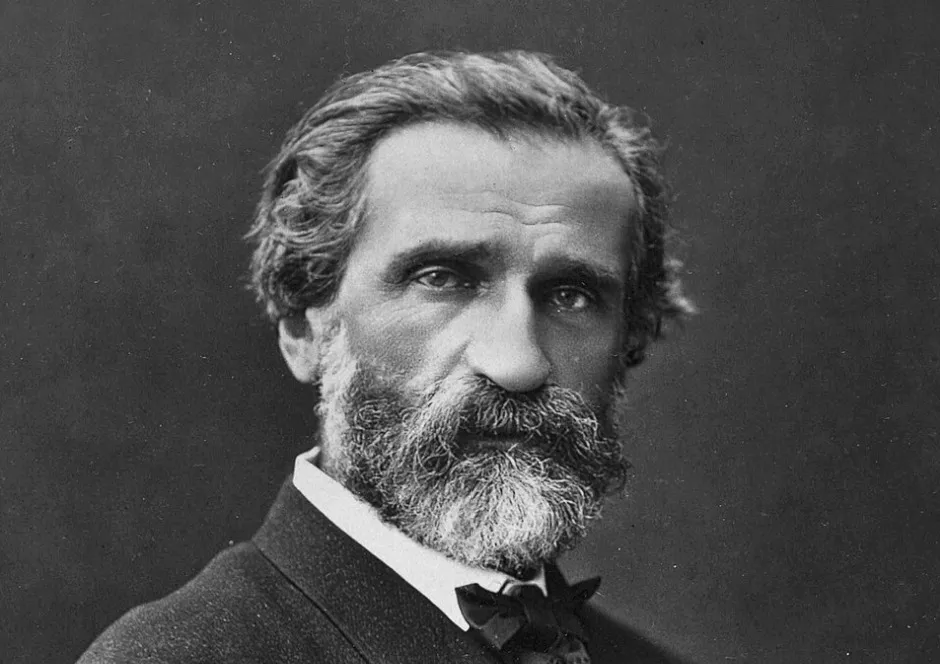 Black and white portrait of Giuseppe Verdi, an Italian Baroque composer with a beard and bow tie.