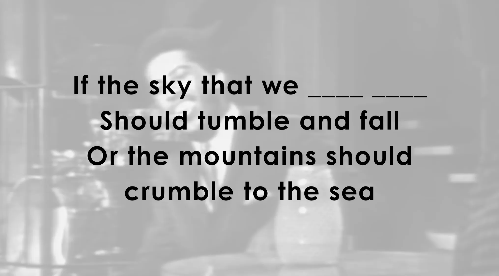 Black and white image with a music lyrics challenge to complete the lyrics with a blank space for the answer.