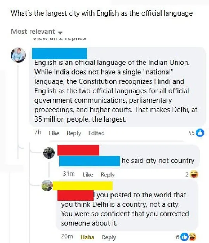 A social media interaction where someone corrects a poster about the largest city with English as an official language, revealing themselves as know-it-alls.
