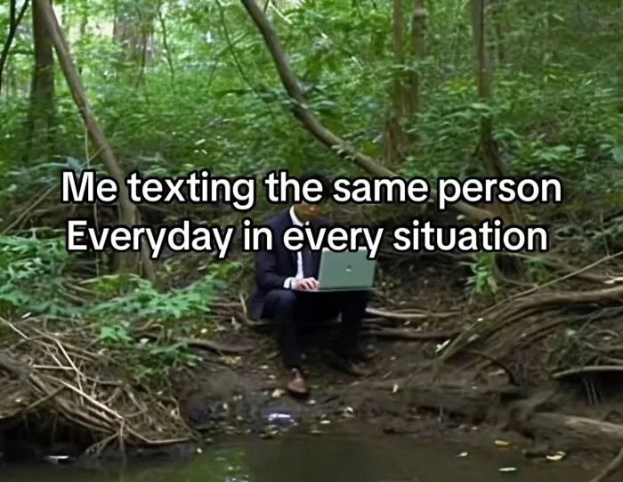 A man with a laptop in a forest, representing relatable memes about constant texting.