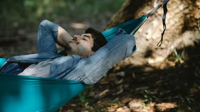 I've been having major cabin fever recently, working from home. Getting outside helps, but I've mainly stayed in my own yard, so I've started sleeping in a hammock under the stars. It's nice, peaceful, and it makes me feel a lot less like a rat in a cage. My neighbors are bothered by it, saying it’s weird and they don't want someone sleeping outdoors near where their kids play, which makes their family have less privacy. I honestly don’t pay them any attention while sleeping outside, just trying to relax and stay sane, so I don’t see the problem.